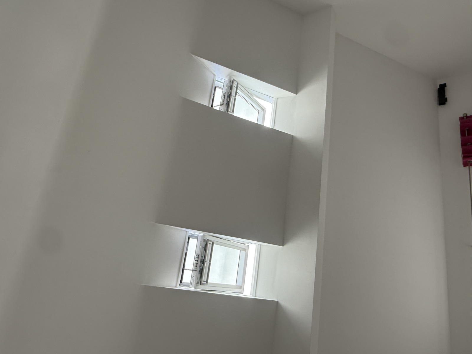 Two white VELUX GGU roof windows with finished internal reveals in Knutsford