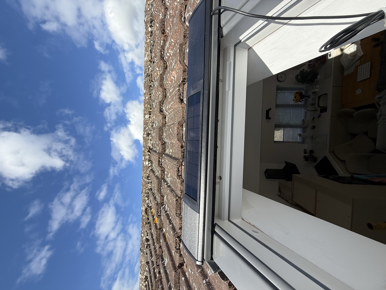 VELUX CK02 roof window installed with EDW flashing into profiled roof tiles
