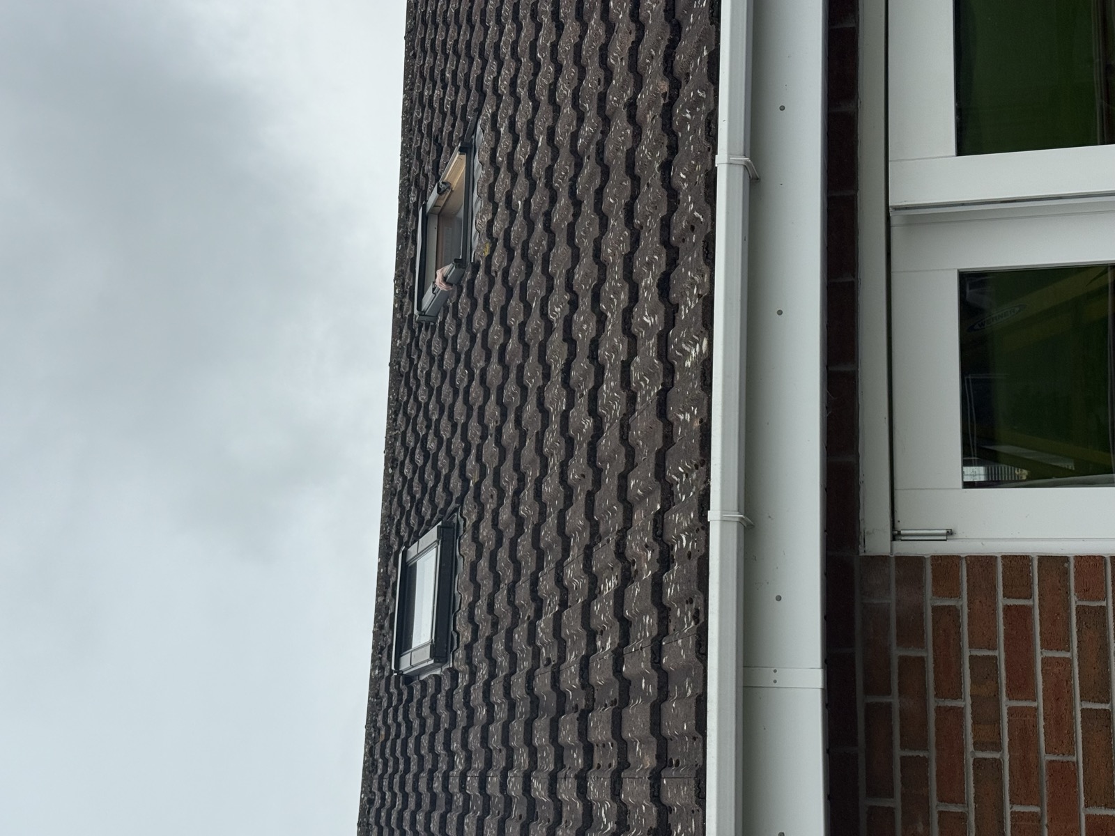 Two existing wooden FAKRO roof windows before replacement in Knutsford